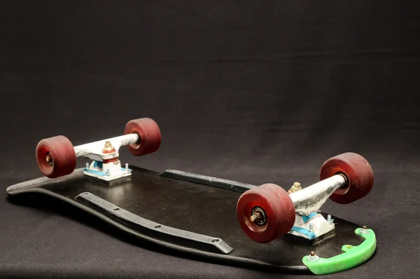 Oude gebruikte houten skateboard — Stockfoto