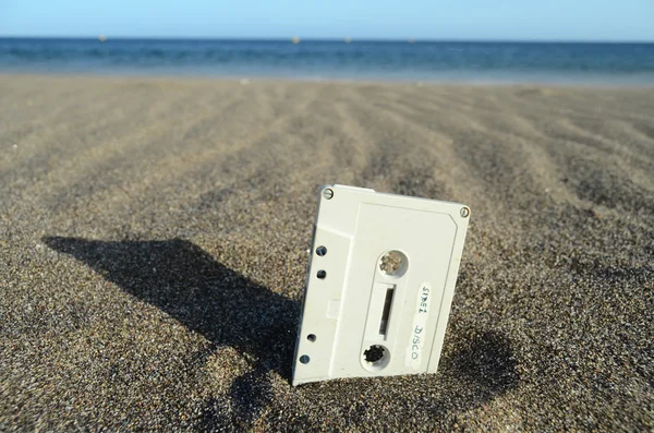 Ancient Retro Musicassette on the Sand — Fotografie, imagine de stoc