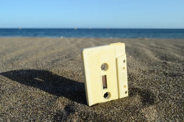 Ancient Retro Musicassette on the Sand — Fotografie, imagine de stoc