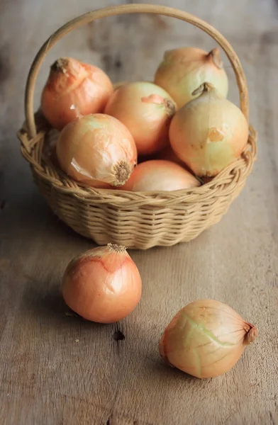 Onion on wood background — Stock Photo, Image