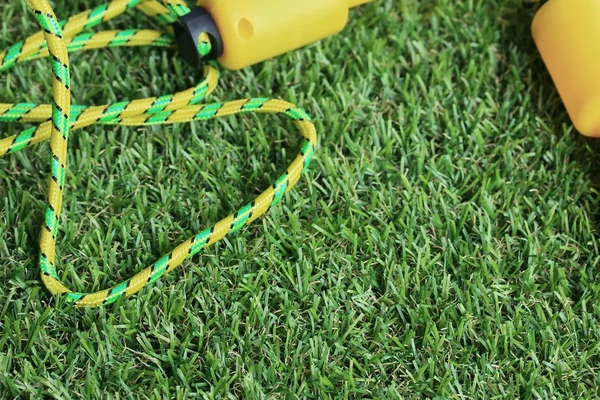 Jump rope on lawn — Stock Photo, Image