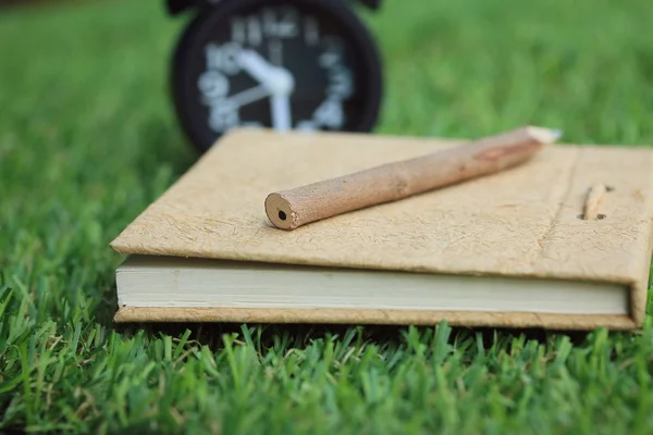 Time clock with book — Stock Photo, Image