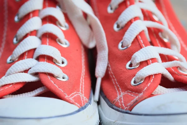 Red sneakers on lawn — Stock Photo, Image