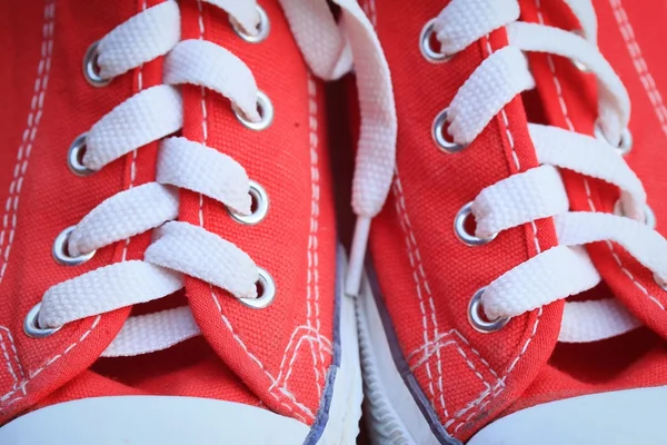 Red sneakers on lawn — Stock Photo, Image