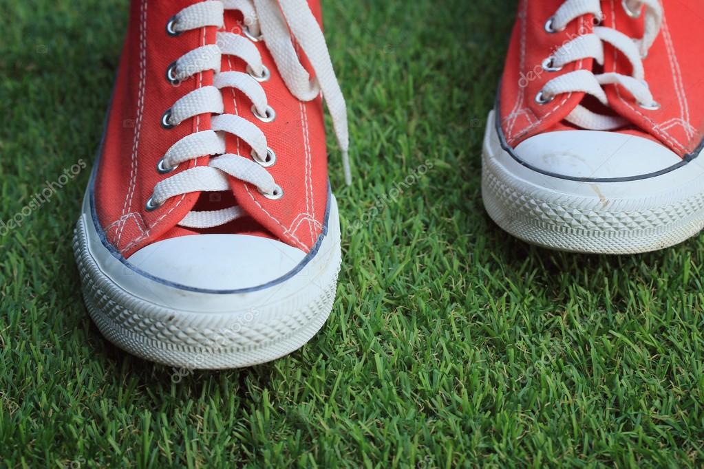 sneakers on turf
