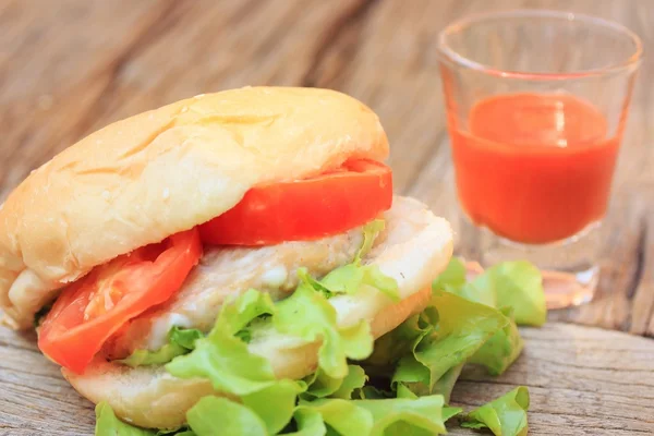 Hamburger with tomato sauce — Stock Photo, Image