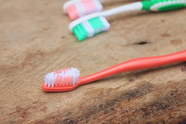 Toothbrush on a wooden — Stock Photo, Image