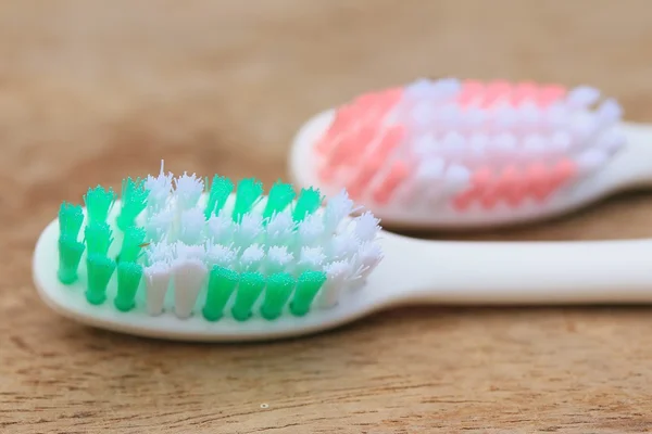 Toothbrush on a wooden — Stock Photo, Image