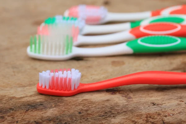 Toothbrush on a wooden — Stock Photo, Image