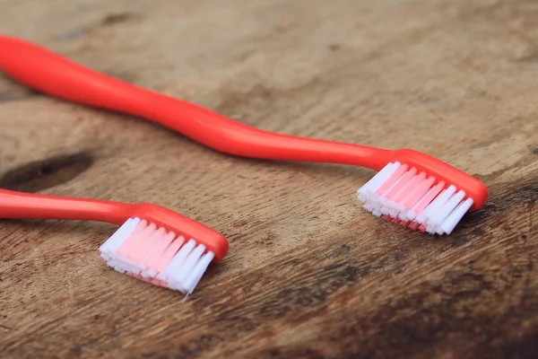 Toothbrush on a wooden — Stock Photo, Image