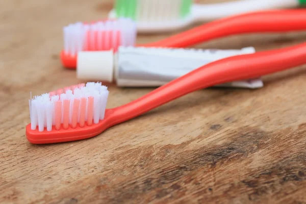 Toothbrush on a wooden — Stock Photo, Image