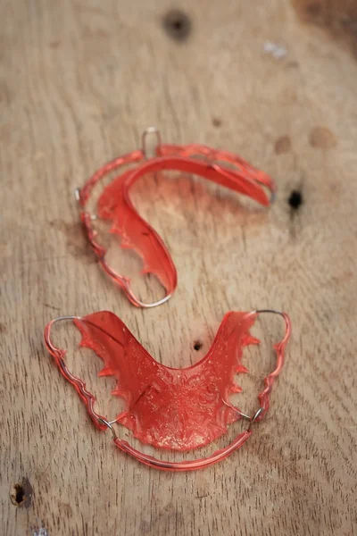 Retainer denter on wooden — Stock Photo, Image