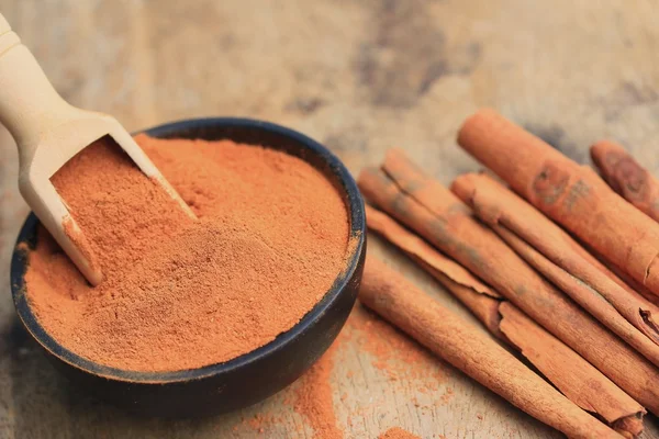 Cinnamon powder with strick — Stock Photo, Image
