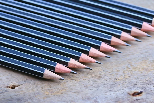 A lot black pencils — Stock Photo, Image