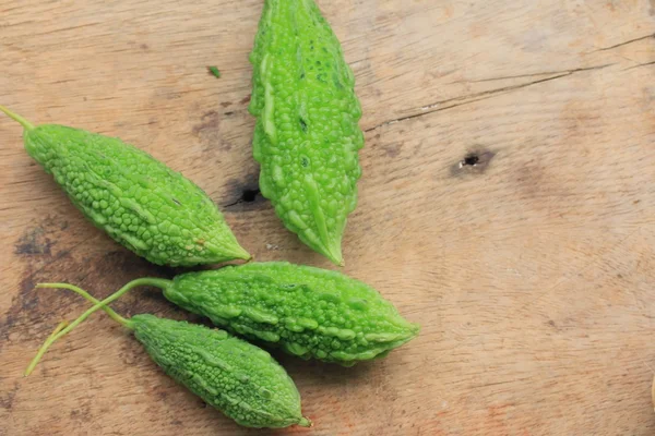 Bitter melon on wood background — Stock Photo, Image