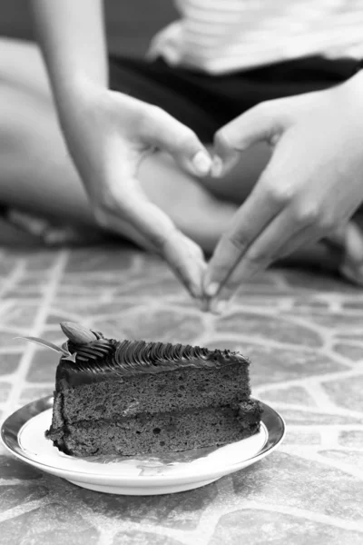 Chocolate cake and handshake symbol of love.