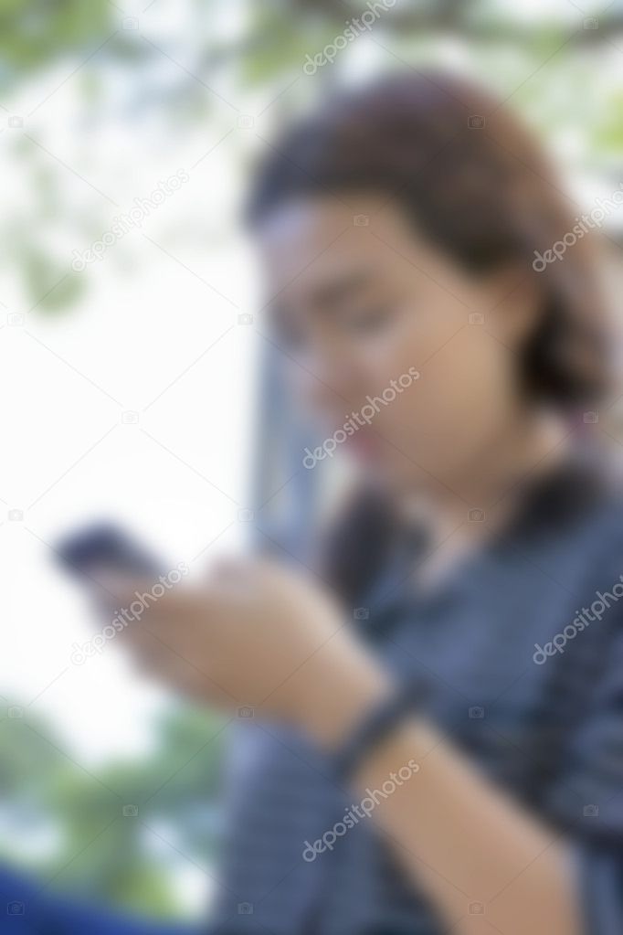blurred women using smart phone