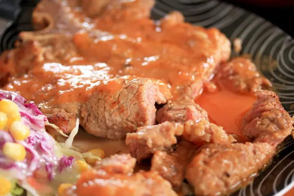 Steaks, pork, french fries with salad. — Stock Photo, Image