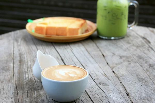 Vintage latte art kávé — Stock Fotó