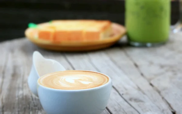 Vintage latte art coffee — Stock Photo, Image