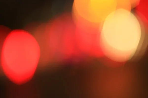 Bokeh borrosa de coche en la ciudad por la noche —  Fotos de Stock