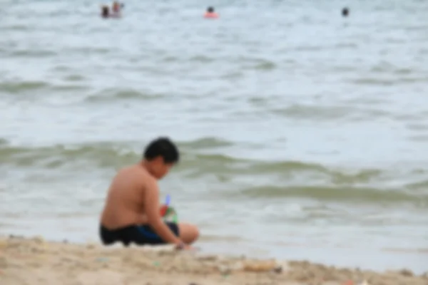 Niewyraźne ludzi na plaży — Zdjęcie stockowe