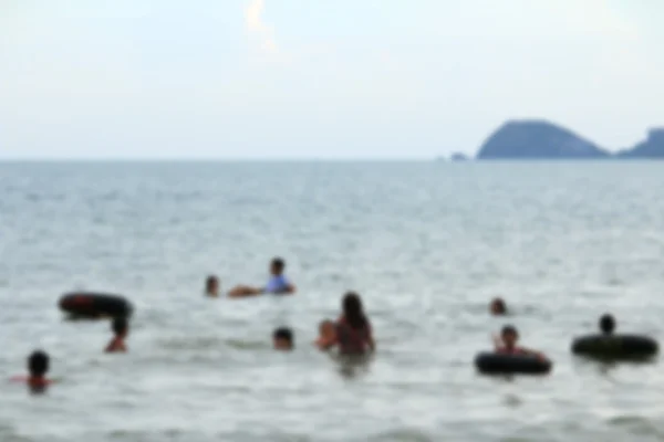 Slørede mennesker på stranden - Stock-foto