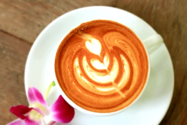Starodawny sztuka kawa i różowy storczyk — Zdjęcie stockowe