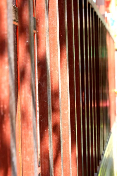 Shadow red wooden fence — Stock Photo, Image