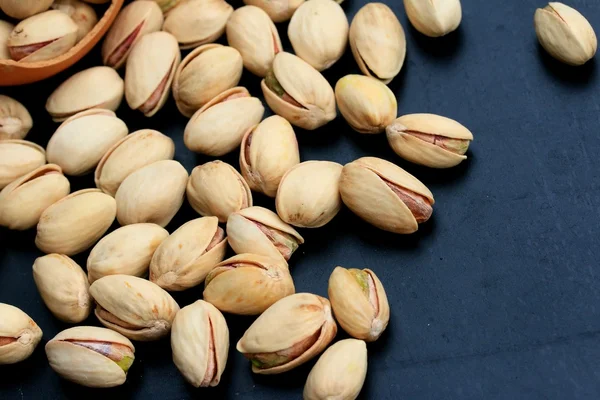 Pistachios nuts on wood vintage Stock Picture