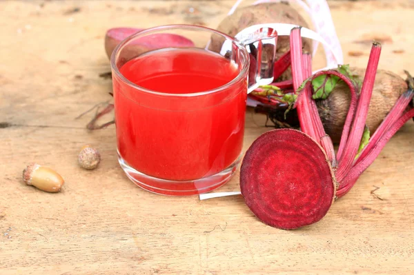 Fresh vegetables beetroot juice and a tape measure — Stock Photo, Image