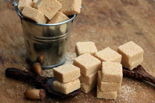 Heap sugar cubes on natural — Stock Photo, Image