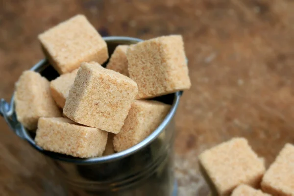 Heap sugar cubes on natural — Stock Photo, Image