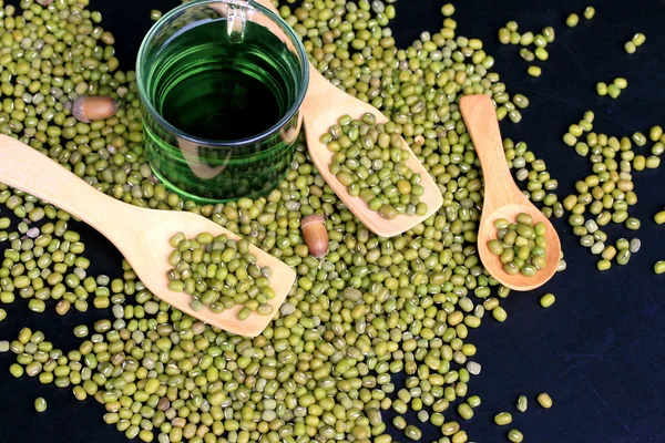 Green beans dried and water chlorophyll on black background. — Stock Photo, Image