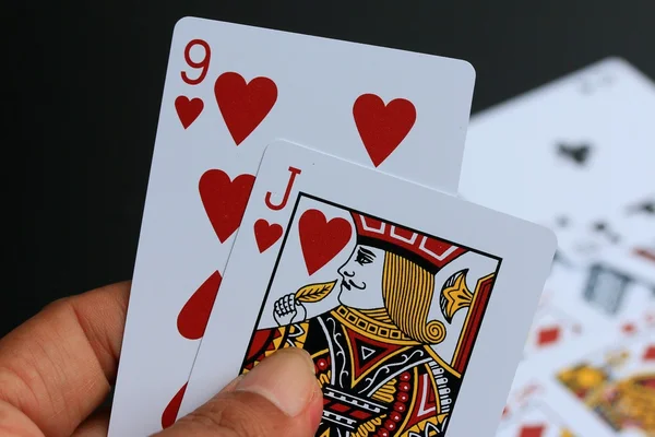 Playing cards on black background — Stock Photo, Image