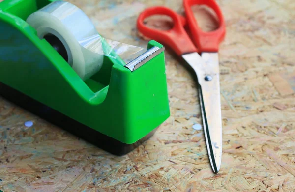 Mix book and calculator, stapler, tape, paper punch, pencil — Stock Photo, Image