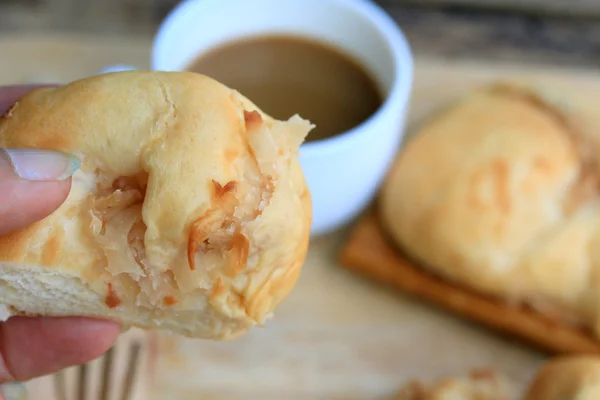 Tasty coconut bread and hot coffee — Stock Photo, Image