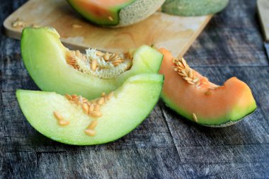 mix fresh green and orange melon clipart