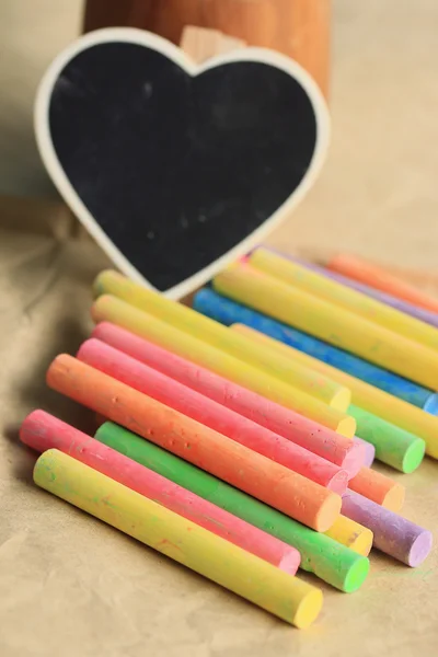 Colorful chalk with black heart — Stock Photo, Image