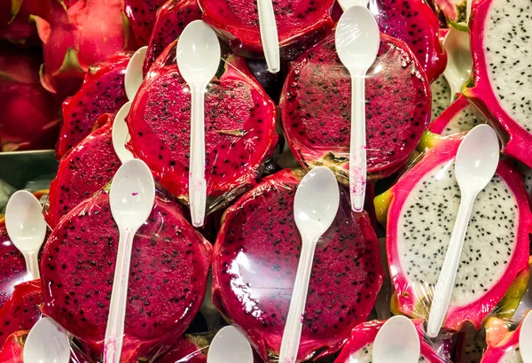 Dragon fruit, exotic Thai fruits, cut, with spoons