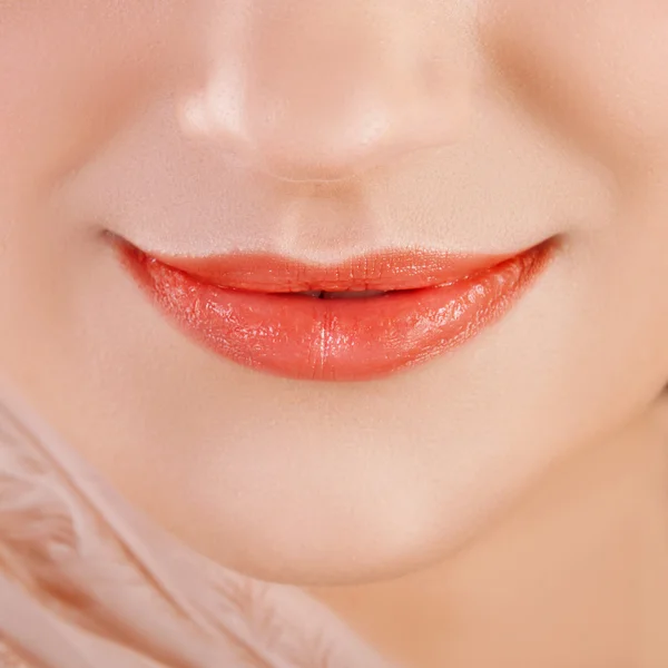 Juicy orange lips closeup — Stock Photo, Image