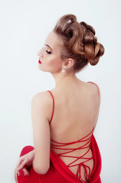 Beautiful sexy woman in red satin dress and red lips — Stock Photo, Image