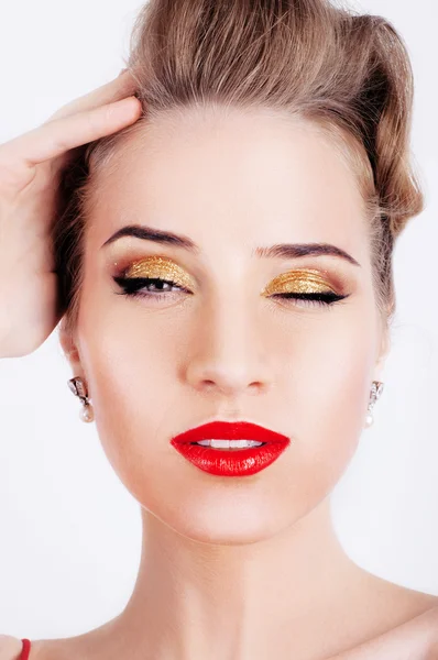 Beautiful sexy woman with party makeup winking — Stock Photo, Image