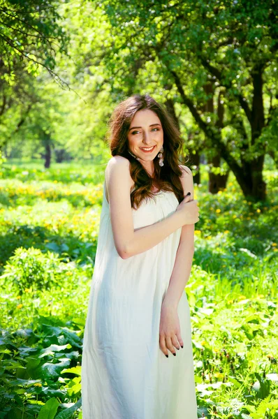 Woman in a long white dress — Stock Photo, Image