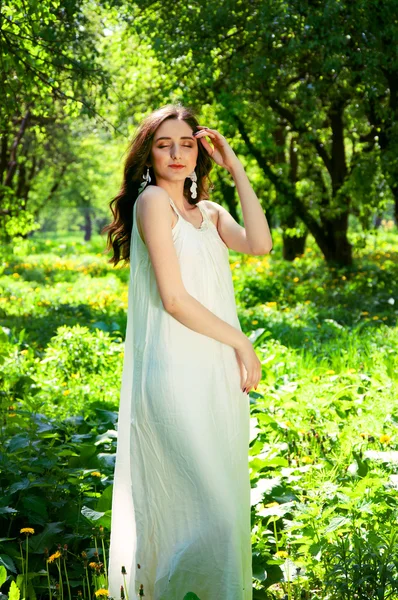 Woman in a long white dress — Stock Photo, Image