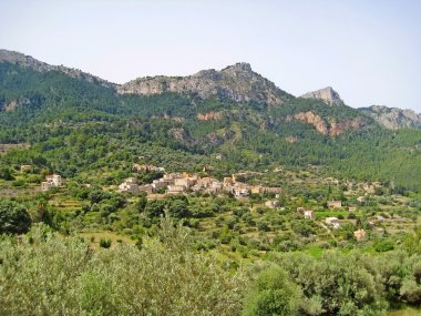 Rural village in the Sierra de Tramuntana mountains clipart