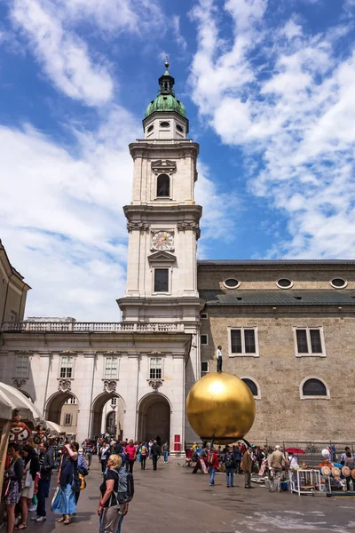 Kapitelplatz, Salzburg, golden sphere with man standing on top — Stock Photo, Image