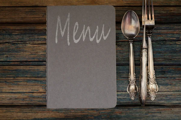 Vintage restaurant menu on a rustic wood background — Stock Photo, Image