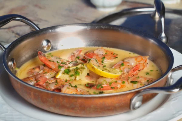 Shrimps in garlic butter sauce dish