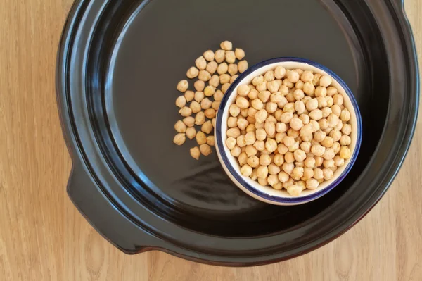 Overhead view of bowl filled with chick peas inside a tagine — Stock Photo, Image
